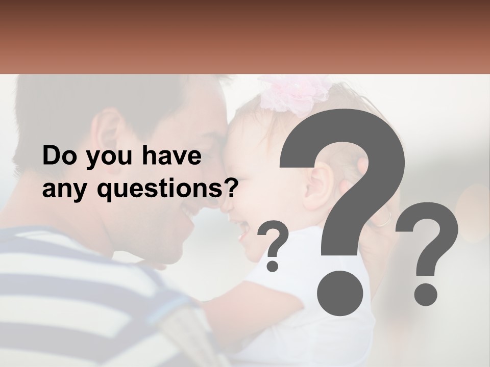 A Man Holding A Baby And Smiling At The Camera PowerPoint Template