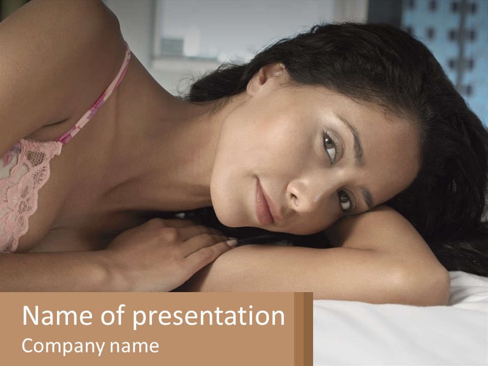 A Beautiful Woman Laying On Top Of A Bed PowerPoint Template