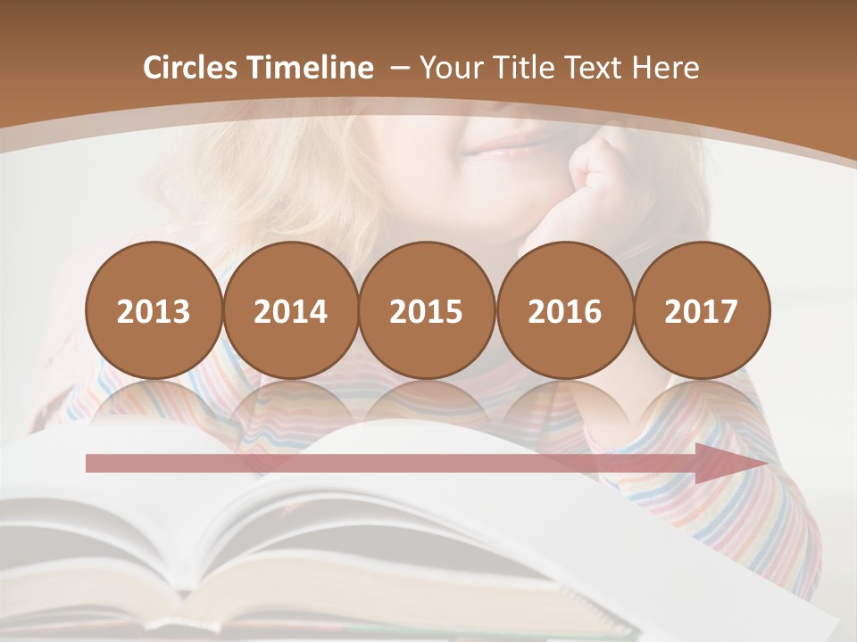 A Little Girl Is Reading A Book On A Table PowerPoint Template