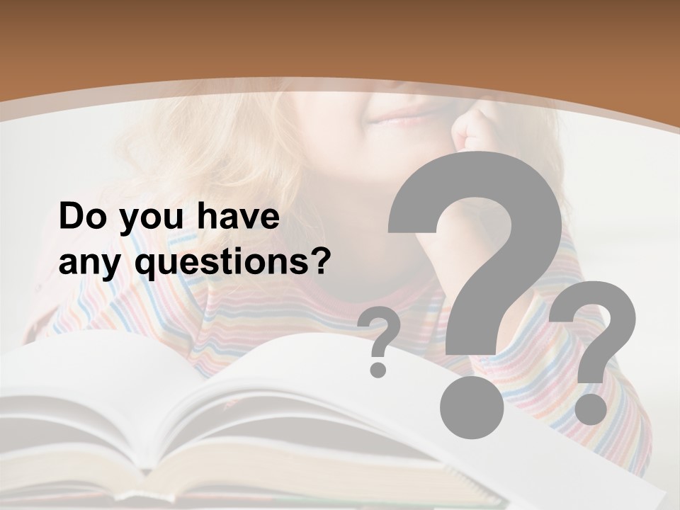 A Little Girl Is Reading A Book On A Table PowerPoint Template