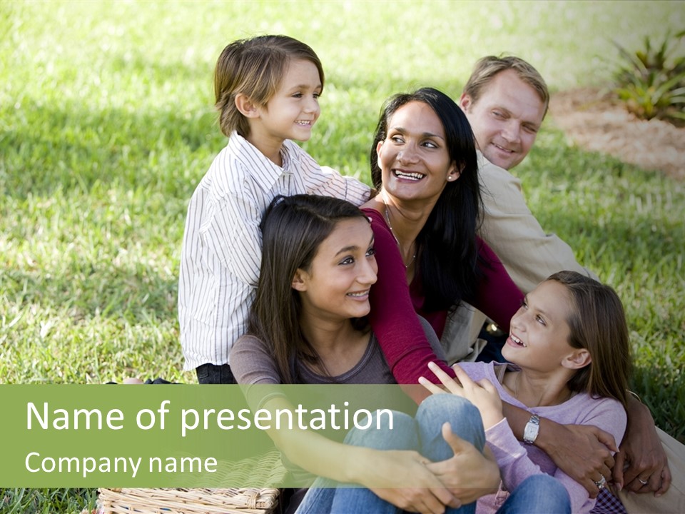 A Group Of People Sitting In The Grass PowerPoint Template