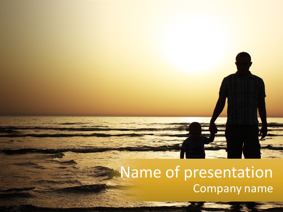 A Man Holding A Child's Hand While Standing On A Beach PowerPoint Template