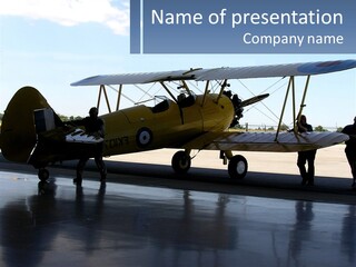 A Small Yellow Airplane Sitting On Top Of An Airport Tarmac PowerPoint Template