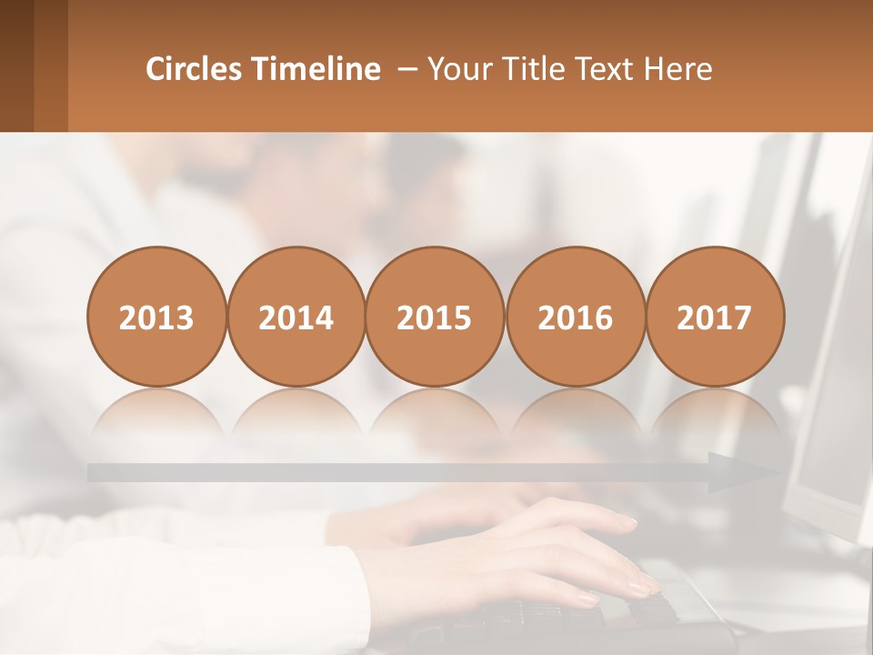 A Group Of People Working On Computers In A Row PowerPoint Template