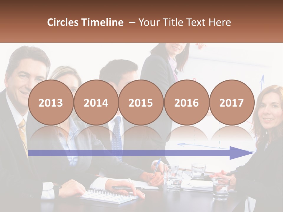 A Group Of Business People Sitting At A Table PowerPoint Template