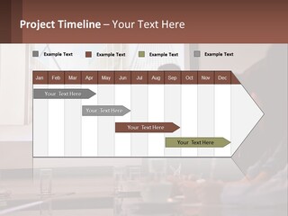 A Man Giving A Presentation To A Group Of People PowerPoint Template