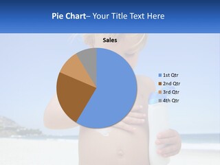 A Young Child Holding A Bottle Of Sunscreen On The Beach PowerPoint Template