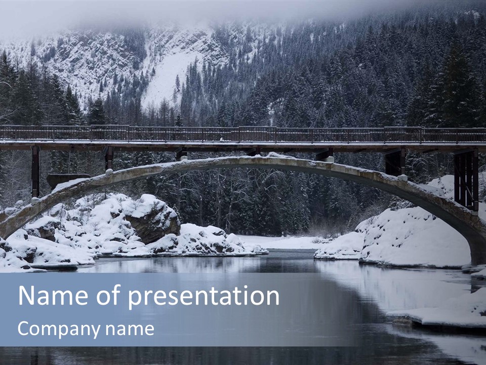 A Bridge Over A Body Of Water Covered In Snow PowerPoint Template