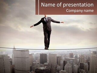 A Man Walking On A Tight Rope Over A City PowerPoint Template