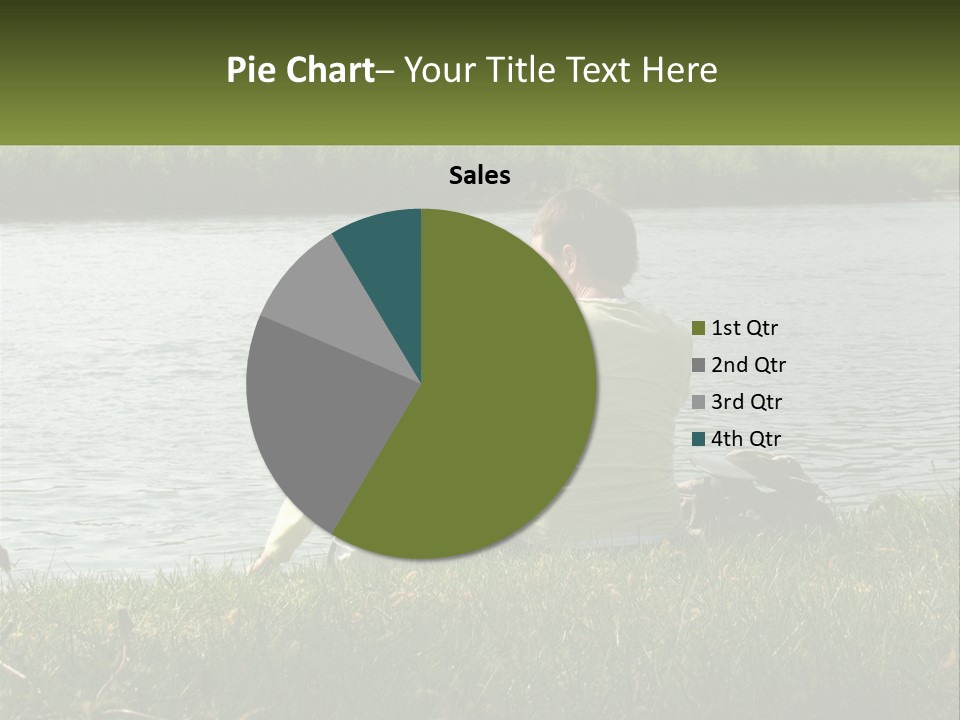 A Man And A Child Sitting On The Grass Near A Body Of Water PowerPoint Template