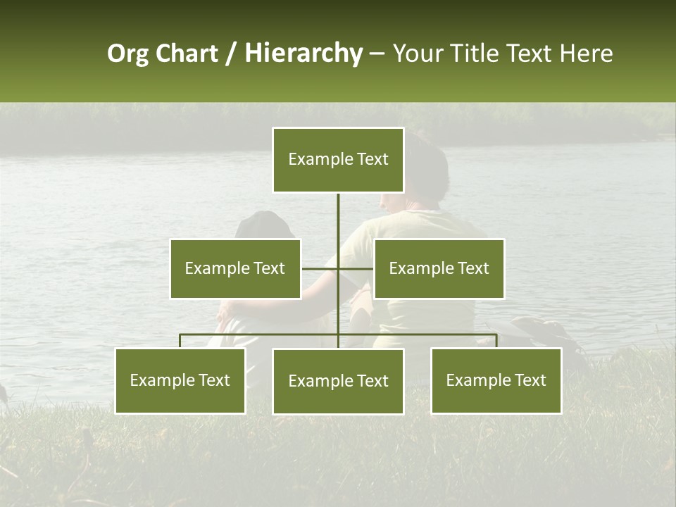 A Man And A Child Sitting On The Grass Near A Body Of Water PowerPoint Template
