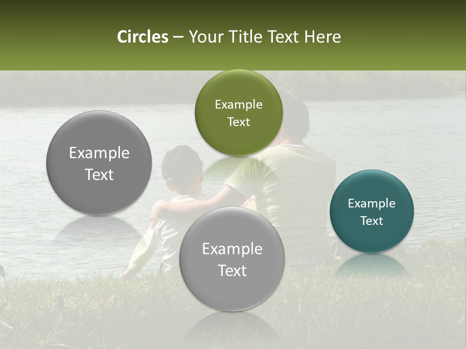 A Man And A Child Sitting On The Grass Near A Body Of Water PowerPoint Template