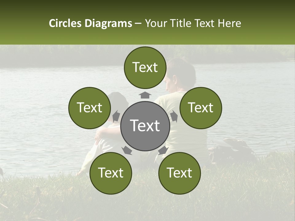 A Man And A Child Sitting On The Grass Near A Body Of Water PowerPoint Template