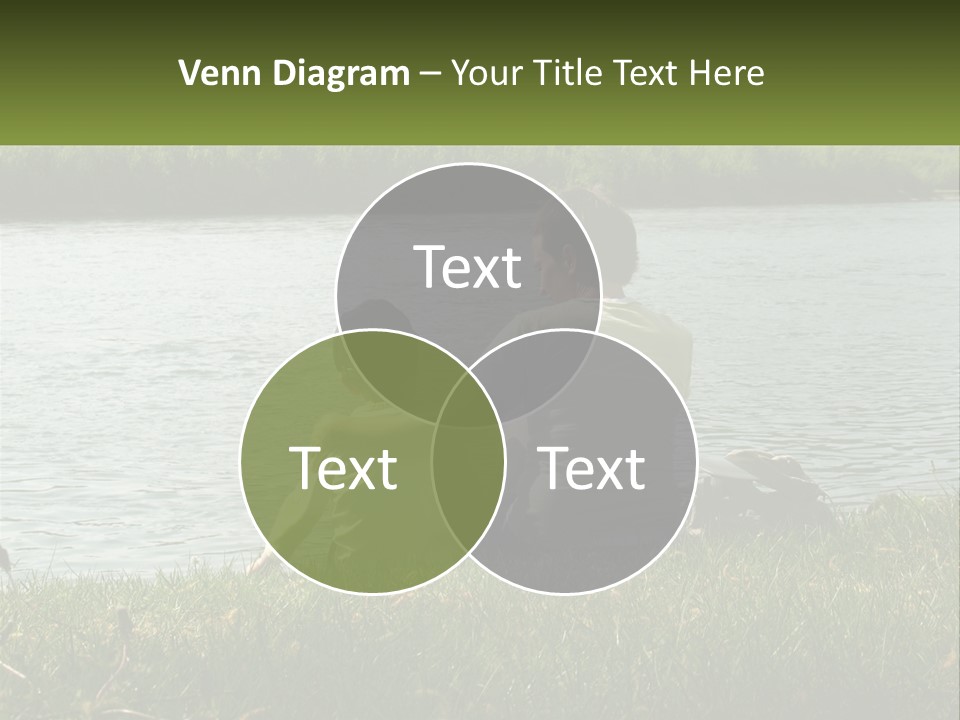 A Man And A Child Sitting On The Grass Near A Body Of Water PowerPoint Template