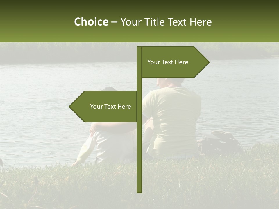 A Man And A Child Sitting On The Grass Near A Body Of Water PowerPoint Template