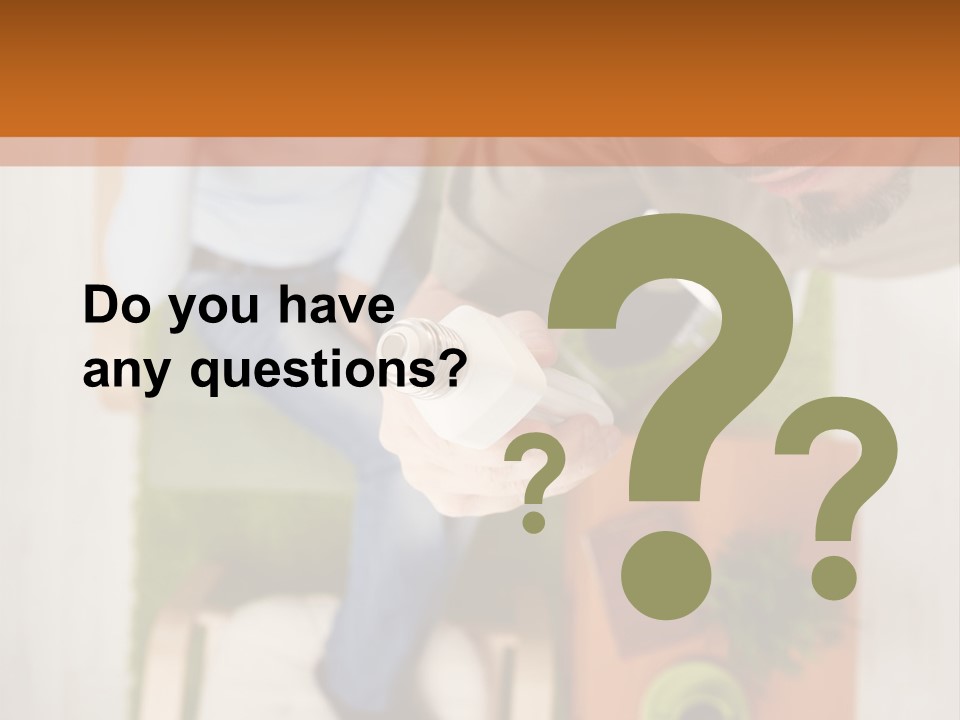 A Man And Woman Sitting On A Couch In A Living Room PowerPoint Template