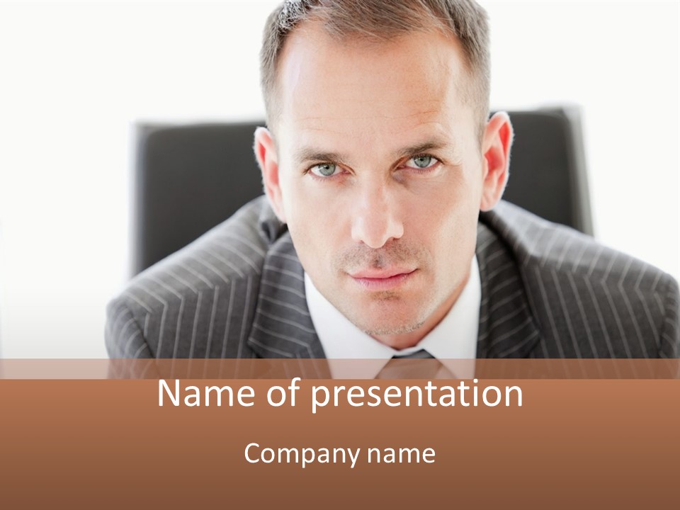 A Man In A Suit Is Looking At The Camera PowerPoint Template