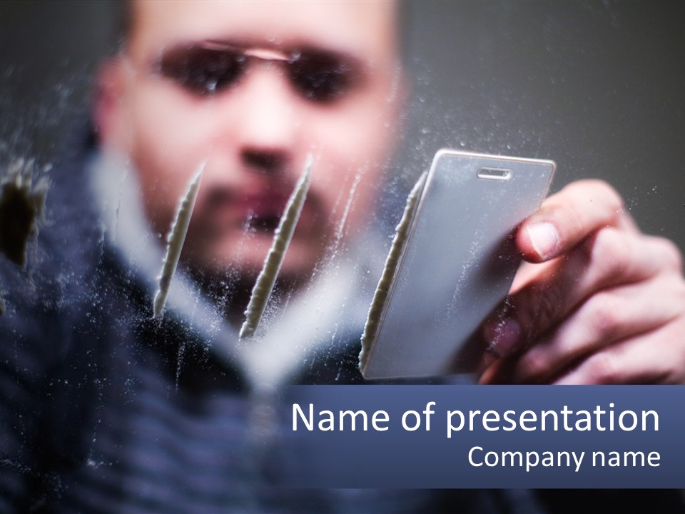 A Man Holding A Cell Phone In His Hand PowerPoint Template