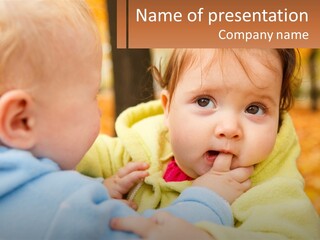 A Baby With A Yellow Jacket Is Looking At Another Baby PowerPoint Template