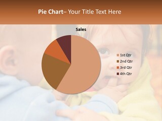 A Baby With A Yellow Jacket Is Looking At Another Baby PowerPoint Template