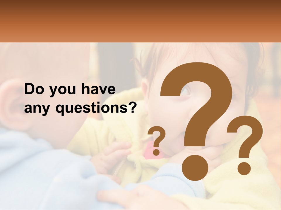 A Baby With A Yellow Jacket Is Looking At Another Baby PowerPoint Template