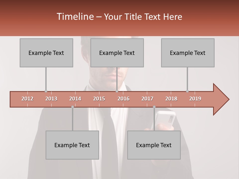 A Man In A Suit Looking At His Cell Phone PowerPoint Template