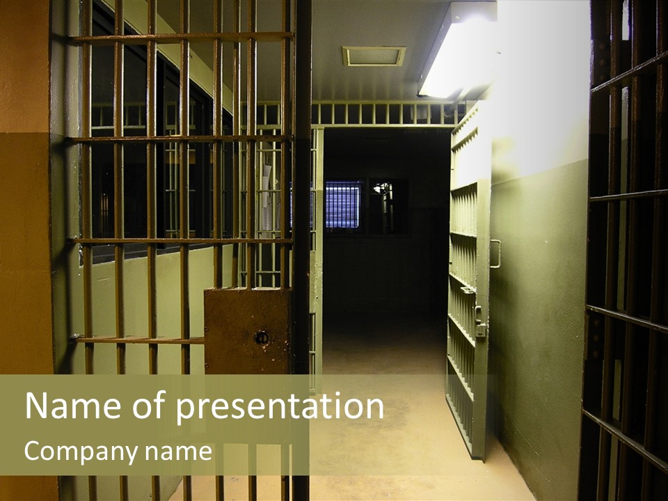 A Jail Cell With A Door Open And A Light On PowerPoint Template