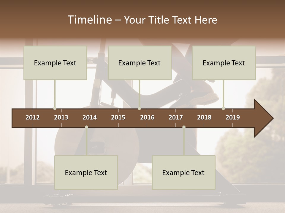 A Woman Riding A Stationary Bike In A Gym PowerPoint Template