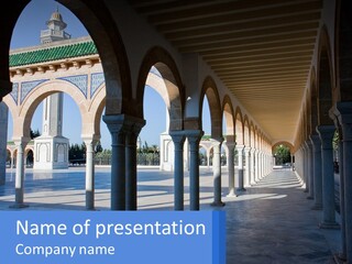 A Building With Arches And Pillars With A Sky Background PowerPoint Template
