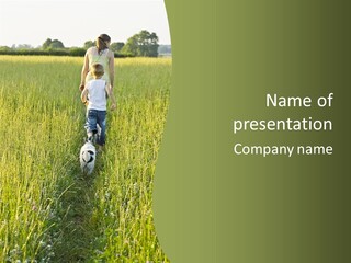 A Woman And A Child Walking Through A Field With A Dog PowerPoint Template