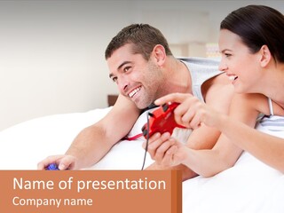 A Man And Woman Laying On A Bed With A Red Object PowerPoint Template