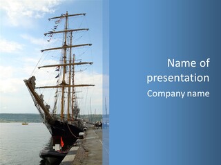 A Boat Is Docked In The Water Next To A Dock PowerPoint Template