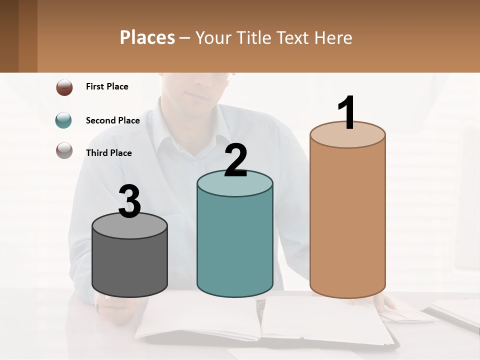 A Man Sitting At A Desk In Front Of A Computer PowerPoint Template