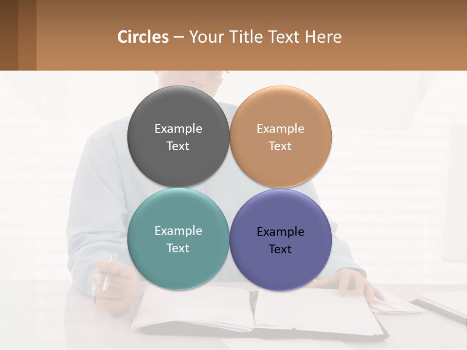 A Man Sitting At A Desk In Front Of A Computer PowerPoint Template