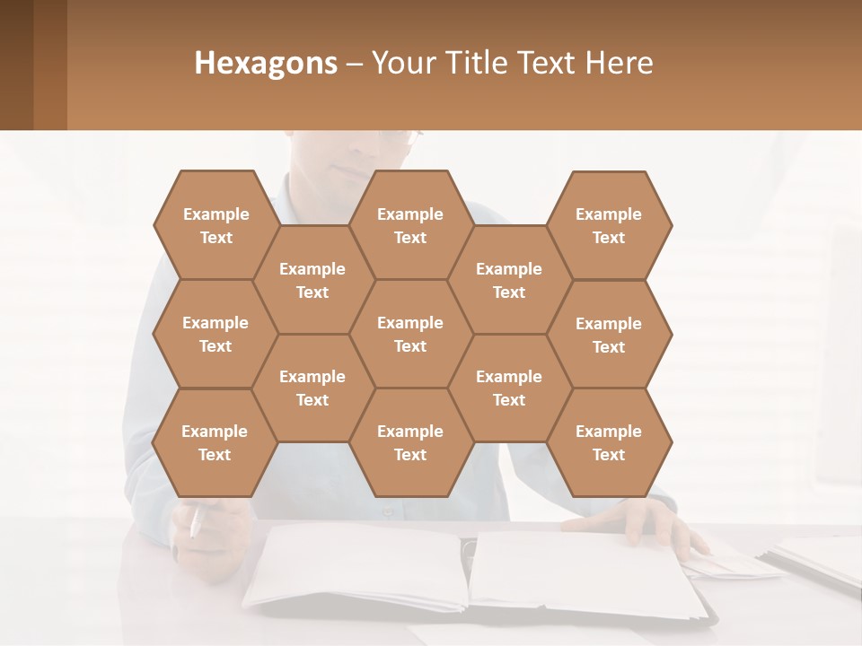 A Man Sitting At A Desk In Front Of A Computer PowerPoint Template