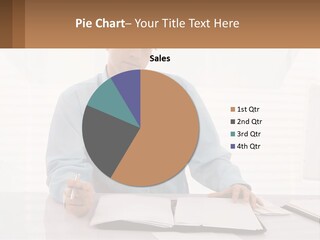 A Man Sitting At A Desk In Front Of A Computer PowerPoint Template