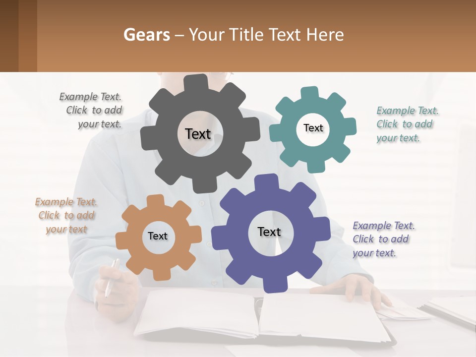 A Man Sitting At A Desk In Front Of A Computer PowerPoint Template
