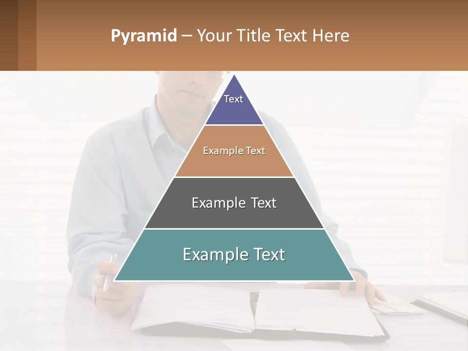 A Man Sitting At A Desk In Front Of A Computer PowerPoint Template