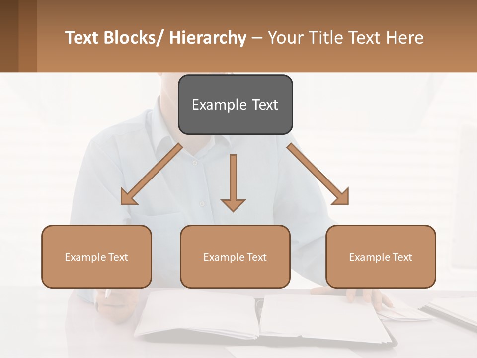 A Man Sitting At A Desk In Front Of A Computer PowerPoint Template