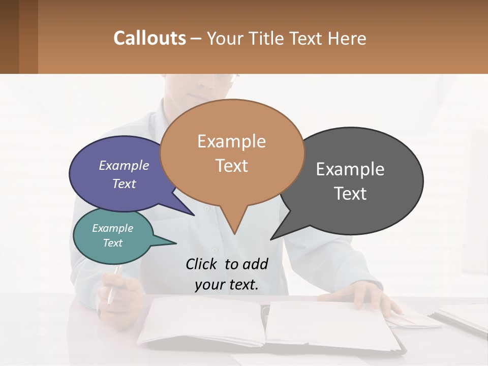A Man Sitting At A Desk In Front Of A Computer PowerPoint Template