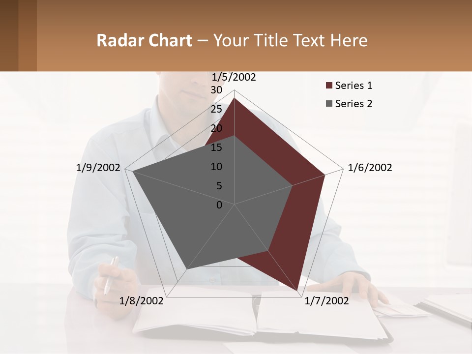 A Man Sitting At A Desk In Front Of A Computer PowerPoint Template