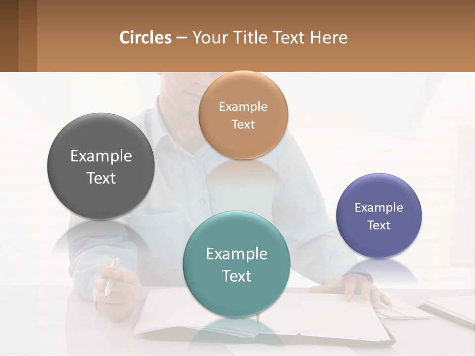 A Man Sitting At A Desk In Front Of A Computer PowerPoint Template