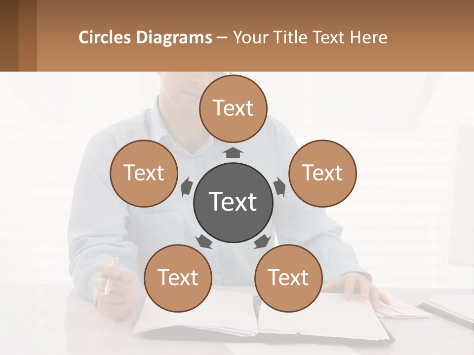 A Man Sitting At A Desk In Front Of A Computer PowerPoint Template