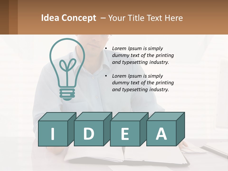 A Man Sitting At A Desk In Front Of A Computer PowerPoint Template