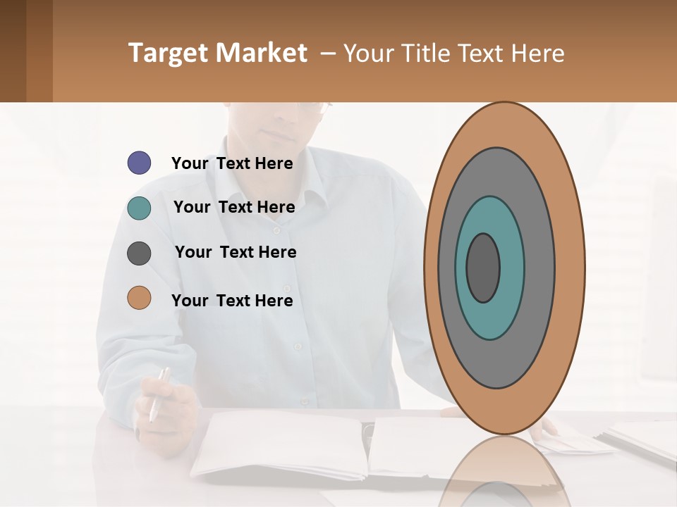 A Man Sitting At A Desk In Front Of A Computer PowerPoint Template