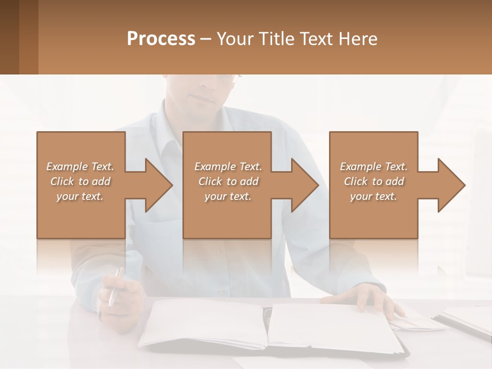 A Man Sitting At A Desk In Front Of A Computer PowerPoint Template