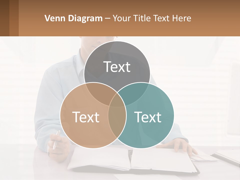 A Man Sitting At A Desk In Front Of A Computer PowerPoint Template