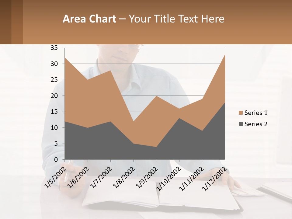 A Man Sitting At A Desk In Front Of A Computer PowerPoint Template