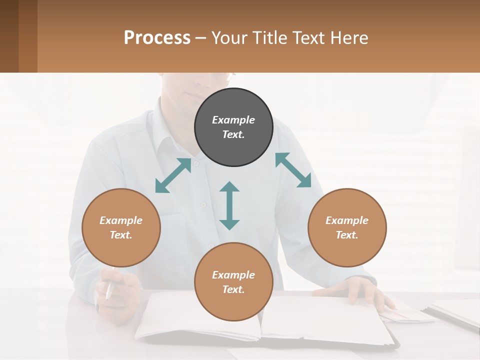 A Man Sitting At A Desk In Front Of A Computer PowerPoint Template