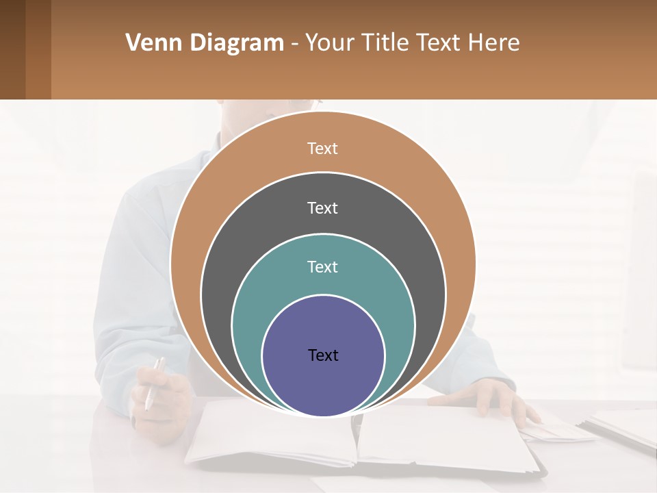 A Man Sitting At A Desk In Front Of A Computer PowerPoint Template